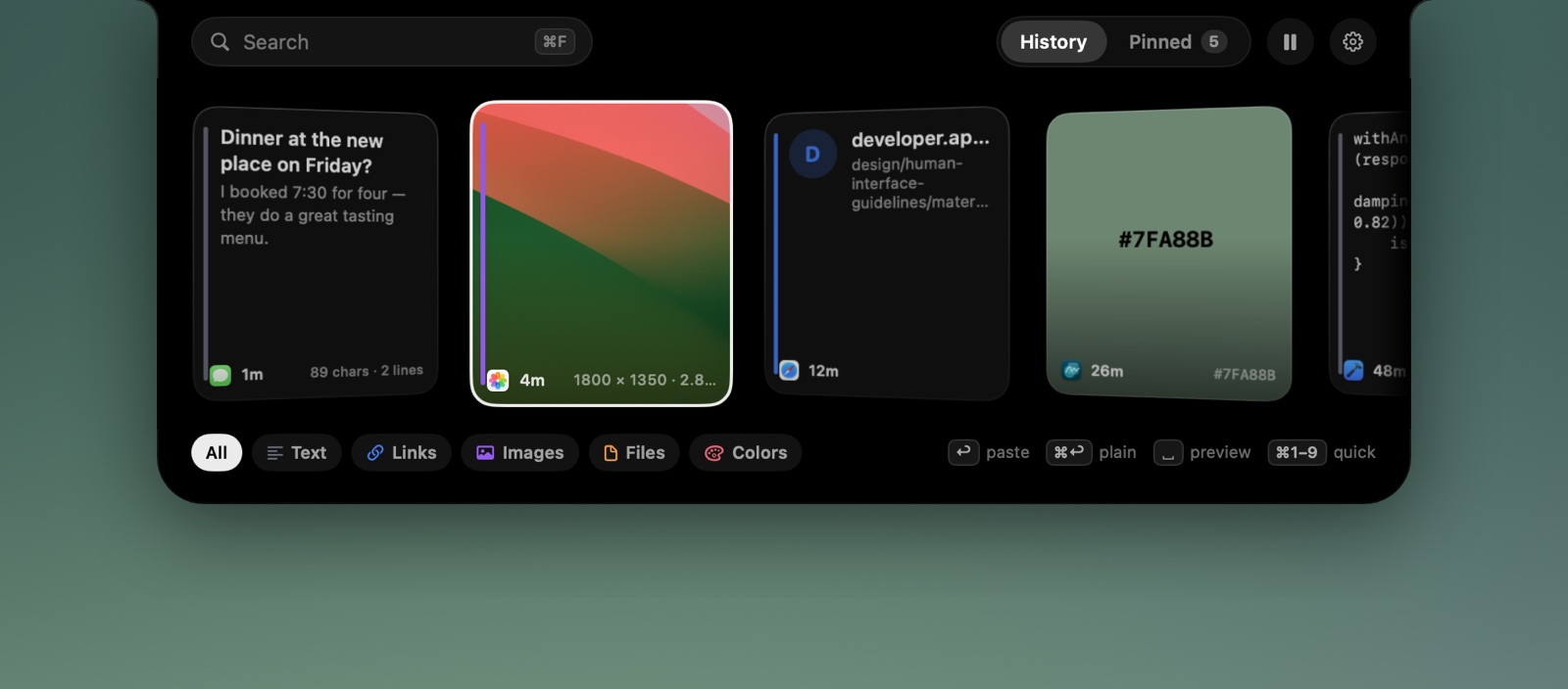 The xcv island open at the top of the screen, showing clipboard cards: a message, a photo, a link, a colour swatch and a code snippet.